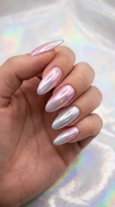 Close-up macro of almond-shaped nails with an iridescent chrome finish